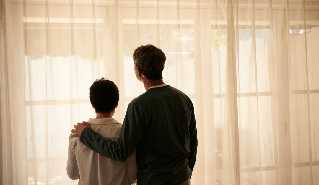 parent with hand on kids back